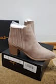 These booties are slighty larger than expected.  I usually buy 8 or 8.5 in boots & booties so i can wear thicker socks in winter. I bought these in a size 8 and they are still a bit roomy. However, i think that works perfectly for me. These booties also go great with dark jeans, or leggings. I think they especially look amazing with dark blue jeans like the ones I'm wearing in the pic. The suede material looks very nice. The heels are pretty comfortable considering they are block heels and not too high. I did some walking around in them for several hours and had no foot  pain. Love these so much! Will be wearing them often. Perfect for fall, but also great in winter (just avoid wearing them on rainy or snowy days due to the suede). - Laura D.