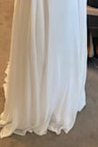I had been eyeing this dress for a long time and was waiting for it to come back in stock.  Like many others, I had to postpone my big wedding, but I am still getting married with a mini-mony on the beach. This is the perfect flowy but still fancy dress at a great price!  The beading and jewels on the upper part of the dress are even more beautiful in person.  It is so sparkly! The dress comes with cups and padding that make the boobs look great and you don't need to wear a bra at all. I tried both an 8 and a 10. There is a slight difference in sizing, I chose the 10 because I have a large ribcage and the dress fit more comfortably.  I am tall, 5'9" and the dress is still long on me, so it's definitely good for tall girls or will need to be hemmed. I HIGHLY recommend if you can get it before it's out of stock again. - Carlina V.