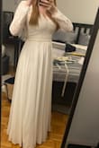 This dress was perfect! I had to downsize my wedding to immediate family only and didn't get to go wedding dress shopping at a bridal shop before COVID hit. I ordered a different dress from Lulus originally but panic bought this one 3 weeks before my wedding after I dropped off the original dress to be hemmed by a tailor I didn't trust and I'm very happy with that decision. 

There were a couple things I didn't love. The ribbon in middle looked kind of cheap to me so I added a thin pearl belt to cover it up. I also noticed in pictures from the wedding that the dress kind of slipped off my shoulder a bit.

I did have to get about an inch hemmed but it otherwise fit well. One picture is before hem and no belt and the other is after hem with the belt. - Courtney T.