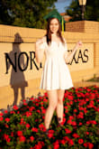 I was a bit hesitant about ordering a Small since the sizing chart said I would be a rough Medium (I often have trouble with sizing charts). I took a leap of faith and ordered the Small size and it fit perfectly! My only complaint was that I couldn't move my arms much in the tight sleeves - but I really only used the dress for graduation photos (since covid canceled my actual graduation). Nonetheless, I loved the dress! Would definitely recommend for this sort of occasion! - Sarah T.
