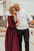 I wore this to my engagement photos and it photographed beautifully! The photographers loved it and the color was awesome! I little low cut and I'm quite chesty so that was a bit of an issue but otherwise perfect dress! - Shelby R.