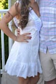 Got this dress for our quarantine bridal shower. It was a little big on me because I am short so I washed it so it would shrink in the dryer. It was loose fitting on the waist but tighter on the natural waist. I am really skinny and in some photos it made it look like I had a stomach which you can see in the photos. Also you have to wear either no bra for the open back or a sticky bra which is what I did. I love this dress overall and will wear it many more times. - Melissa D.
