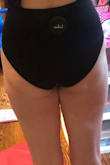 This suit was perfect on the top half. Smooth material, comfy, sexy. BUT the bottom. It was way too skinny in the front AND back. I don't understand why so many swimsuits are cut this way now. Please explain to me why I would want to show off the edges of my crotch area in the front.

The coverage in the crotch area looks totally acceptable on the model. But that is not how it looked on me. So frustrating. Plus, the way the bottom was cut in the back was not flattering. I don't mind a bit of cheekiness, but the angle was just weird. - Chelsea P.