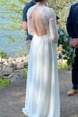 I bought this dress as a last minute wedding dress since COVID changed my wedding plans. I was originally a little scared that the lace would be itchy but it wasn't at all. My only issues was that my boobs were a little too small for it and the length is a little long. Definitely recommend. - Lisa K.