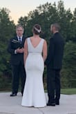 I bought this dress for our small, intimate fall wedding. After trying it on, I knew this was the perfect dress! I decided to have it altered as it was a little long even in heels, and I wanted to be comfortable walking around the day of our wedding. Given the inexpensive price of this dress, it was well worth the cost to have it altered, in my opinion. I also had the tailor add built-in cups so I didn't have to worry about a strapless bra or using tape. I'm not busty so the built-in cups also gave me some shape up top. Needless to say, I felt so beautiful and confident on the day of our wedding!! I received so many compliments from our family and friends, and they couldn't believe this was a $100 dress! - Adrienne B.
