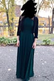 Wore this to play piano at an outdoor fall wedding. It happened to be 35 degrees that day, so I wore leggings underneath and was able to stay nice and warm. The A-line fit made it so you couldn't see any lines from the leggings. I didn't have time to get it hemmed, so I wore 3 inch heels and still could have hemmed an inch or so off. I have a small rib cage, so I probably could have fit into an XS, but S seemed to work just fine. I got many compliments, and it nicely matched the formal style of the wedding. I am hoping to be able to wear it again when it's warm enough to not have to cover the back of the dress. Very happy with my purchase! Would definitely recommend for a formal event! - Sarah H.