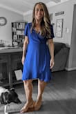 I absolutely loved the dress. It ironed nicely after removed from packaging. I had to pin the bust because it kept opening no matter how tight I had the belts tied. If my breasts were bigger, perhaps it would have fit better. Nonetheless, with a small pin in place keeping it closed, it looked amazing, and no one even noticed. Highly recommend! - Martha W.