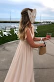 You can't really beat this dress. As a bridesmaid you already have some costs involved and this is a beautiful, flowy dress that flatters all bodies, doesn't break the bank and you won't feel bad when the bottom gets gross after a night of dancing. I (LEFT) am 5'8" and wore 3-3.5 inch heels and didn't have to alter the bottom. I altered the top--there is a bit of extra fabric on top and you will look likely need to tighten the straps. I am in another wedding in February and just bought the same dress, but in green! Oh and the slit, is fire. - Elizabeth K.