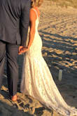 To be honest I ordered this dress and others to simply get a feel for the silhouette I wanted for my wedding dress, I had no intentions of falling in love with it and wearing it for my early Fall beach wedding. This dress turned out to be the one though! The lace looked much more expensive and high quality than I thought I'd receive for such an inexpensive wedding dress. It truly fit my vintage, barefoot in the sand, sunrise nuptials vibe. I have an athletic build, broader shoulders, small breasts, and muscular legs- the Small fit very well just a little extra care had to be taken when zipping by the ribcage so it wouldn't snag. I had a wonderful seamstress tailor the length, add cups so I didn't need a bra, I had a bustle added, and also added a lace cover to snap over the rather large zipper pull. Overall, it fit like a glove and I received a million compliments from my seamstress, my guests, and even our caterers! Most of all I could move and dance freely in it- the lining is stretchy. Highly recommended!! - Gretchen A.