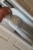 I'm a low budget bride, and I was looking for a dress that would WOW but not cost very much. I found this dress, and the medium size fits me a bit tight (quarantine weight gain, y'all - it's bad lol), so I wasn't able to get the zipper all the way over the waist seam on my own (see picture) but I AM. IN. LOVE. This dress is such good quality - a heavy lace over a thick nude slip, with a small lace train and an unnoticeable zipper in the back. My plan is to wear this dress with a tulle overlay for the ceremony for the drama, and then just this beautiful, romantic, boho-style dress for the reception. I couldn't be happier with how it all turned out! - Jenaye W.