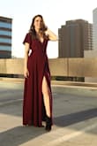 I wore this dress to a wedding and a photo shoot and loved it. The tie allows you to fit to your waist perfectly, and the slit is sexy while the fit is elegant. Only thing that would make it better if it was fully lined instead of lined to high-mid thigh! - Alexandra B.