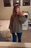 The gray color is kinda blah, but it's a cute sweater! I'm normally in between small and medium sizes, and I got a small here so it wasn't too oversized. I got it to tuck into high waisted pants without it bulging too much. It's not the softest material, but not too uncomfortable or scratchy either. Very average. - Becca S.