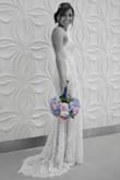 So glad I ordered this dress!  It is even more beautiful in person. I will be wearing it on my wedding day!  I had to get it hemmed and my seamstress said it's super easy to hem without ruining the beautiful lace! - Melissa W.