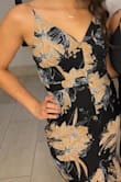 I love the design of the dress and the print. My only objection would be how loose it was for me around the midriff. It fit great around the bust, but at the hips there was a lot of extra fabric. With movement the fabric would fold up and create a weird bulge. - Ashley E.