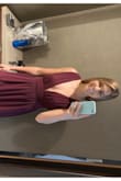 I wore this dress to a formal wedding in mid-October. I was between ordering an XS or a S based on the size chart but the only size that was left in stock was an XS, so I ordered it. I'm so glad I did because it fit me perfectly! If I had ordered a S, it definitely would've been too big. Being 5'3", I had to get the dress hemmed. Even with my tallest heels, the dress was still too long. I just wore tiny sticky boobs and to my surprise, the dress stayed in place perfectly all night, despite how much dancing I did! - Julie T.