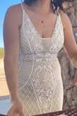 This dress was absolutely gorgeous. It fit perfectly, the adjustable straps help to get a perfect fit around the shoulders and bust.
The beading detail make this dress so, so, so pretty.  I wore it all day and didn't want to take it off!
The only negative thing is that the beads do rub on your arms on the side, so it can irritate your skin after a while. - Suzeth C.