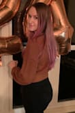 This top is more cropped than what it looks like in pictures. Fits true to size and looks really good for the fall time! - Megan P.