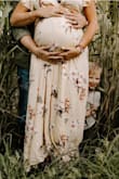 This dress was a dream for maternity pictures. The color does look different due to photographer editing, but was great to have a dress that I could wear while pregnant and after due to it's versatility. Wrap dress for the win! - Krysta B.
