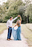 wore this dress for my engagement pictures! ABSOLUTELY LOVED IT! It does cut down super low in the front as well as the sides. I hid the strings that tie in the dress because I like it better without it. I normally am a small and got the XS in the dress. - Haley C.