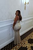 The dress is a must buy! The material is stretchy, especially around the hips. Straps are adjustable. I received so many compliments all night. I will buy again in a different color. - Edlyn L.