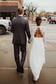 I purchased this as a last minute option for my elopement/ courthouse wedding and it worked out perfectly! I did have to hem the bottom about 4 inches as it does run super long but it turned out so gorgeous in pictures. The back is beautiful as well. - Navpreet S.
