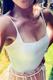 I have been wanting to purchase a tank bodysuit for some time and read quite a few reviews before going with this one. I really like the material and style. The neckline is perfect for a little cleavage and I love that your awkward armpit area fat is covered. I usually order an XS or S from Lulus. I got this in a S and I don't think there is anyway the XS would have fit comfortably. It's small in length, but kind of large in that I had to adjust the straps quite a bit. - Laura S.