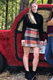 Wish it was a tad longer, but other than that wonderful skirt. Fabric is thick and feels expensive. There is little to no stretch though. Very cute and got lots of compliments on it. I hardly ever wear skirts, but this one was just too cute. - CJ A.