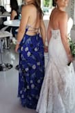 Very long, but so beautiful. Great construction. Though you need another person to help you tie it, it's so worth it! I don't need to wear a bra, and it flows so nicely. Very long, as is typical with Lulus maxi dresses. - Angela M.
