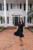 I bought this dress for my friend's wedding as a guest. A lot of people mention the neckline is very low, I do agree but I actually really loved it. I used a small pin to keep it in place and I choose to forgo a bra using petals and fashion tape instead. I received a lot of compliments on the dress and I would highly recommend it. I typically am not a fan of wrap dresses on my body shape but this dress was very lovely on. - Amanda V.