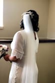 My Covid 2020 wedding dress fit me better than I expected and I love the style! I did worry about the bust... it was a bit loose so my bra kept popping out which scared the crap out of me. I wish it didn't have trim on the sides because it felt too much and the fabric felt cheap too. Also, if you're on the bustier side I recommend a nude or a white bra because the lace on the front, laid right on the bottom of my bra not my torso... Overall it fit like a glove and my heels were the perfect height so I didn't need to trim the bottom and I wish I had time to return it unfortunately my wedding date was too close to risk it. - Brittney M.