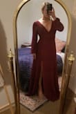 very elegant, and flattering with a slit to mid thigh. the tie in the back helps with placement. sizing is like lulus other dresses, I'm usually a strong M but tend to have to size down to small which this is. it's a bit snug and I wouldn't wear on a bloated day:). the zipper feels cheap and like it is going to snap. will send back because of this. would be great for professional pics, weddings, etc - Jessica M.