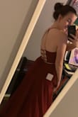 It's very comfortable and padded so you don't need a bra. The back tightens so you can get a super good fit! The slit was a little higher than I thought, but the dress overall is beautiful and makes me feel like a princess. The pictures are from the first time I put it on, so the tags are still on the dress (which is why there's white and black squares dangling haha). Love this dress! - Brielle A.