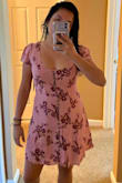 I like this dress' fabric. I like the button detail. It has a zipper along the side. This one has a low cut in the front, maybe wearing a bra it could be difficult (depending on the bra type). It is very flattering as you can adjust the dress and make it hug you however you like to accentuate your figure. - Astrid A.