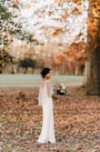 I wanted a simple but timeless dress for my small wedding ceremony this fall. It fit beautifully as is but since I wanted to wear low heels I got it hemmed, cups put in and the straps fitted. The alterations cost me more than the dress itself but it was gorgeous and paired beautifully with a cape I purchased separately. - Marissa B.