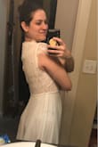 This dress has a lovely pink underlay, but I think it needs a side slit or a low back since the front is coming up so high. It was too loose on me; I would have ordered a small if I chose this dress. Also cap sleeves don't do my arms any favors. - Jessica P.