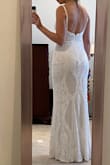 Fits beautifully. Feels and looks expensive. It has this lovely silky lining that feels luxurious. The sequins weren't that bothersome under the arms for me. Don't have to do any alterations to this one. I'll be wearing it for my ceremony micro wedding on the beach! Love it! - Sophia S.