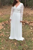 I got so many compliments on this dress. The back is the ultimate draw but overall it fit like a glove. I normally wear a small in most dresses but I wear an XS on this site. Everything fit perfectly! I didn't wear heels so it was a little long but it was good for the small ceremony. - Michaela F.