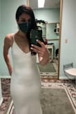 I ordered this dress for our marriage ceremony, and I could not be happier with the fit, feel, look and overall value! The dress is lined, the material has some stretch so it's comfortable and flattering, and I received so many compliments. It looks sleek and nobody believed that it was ordered online for the price I paid. The fit was perfect and needed no alterations. I wore 2.5-3 inch heels for length reference. I absolutely love this dress and want it in other colours! - Melissa L.