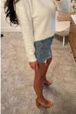 I own another pair of 501 cutoff shorts & knew I needed another pair. I was so excited when I saw these on sale! I love the consistency of Levi sizing. I always wear size 25 in Levi jeans & shorts & these fit just like my others. I'm 120 lbs with 26 inch waist & 36 inch hips. At 5'3" the 9" rise is perfect as I like them to hit at my natural waist. I also appreciate that these are long enough in the back to cover my bum. These have no stretch, so I will usually line dry to avoid shrinking. Sweater & heels in my photos are also from Lulus. Love them all! - Nicole M.