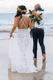 I got this dress for my super last minute elopement. Perfect for a beach wedding! The dress is really comfortable and the lace is of such good quality. I received it the day before my flight so didn't have time to hem it, but I didn't mind it at all since it made it look like a mini train. The only thing I was worried about was the lace being too see-through. Wasn't an issue at all. Just make sure the angle of the lighting is good. I ordered a small and x-small. Both fit nicely, but I opted to go with the x-small since I have a small bust and it hugged my body a little better. The straps aren't adjustable, but I like it that way since it gives the dress a cleaner look. So glad I was able to find a dress in time and couldn't have been happier with how it turned out in pics!! - Mimi N.