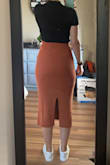 Does run large. Usually would order a medium, but a small fit perfectly. It's sooo cozy and comfy, and I love the stretchy ribbed sweater fabric. Pairs great with crop tops and bodysuits, tights or no tights, and boots or sneakers. Got it in both black and orange and I'm particularly smitten with the creamy orange. It's a lighter color than depicted in the photo, but still love it. - Joy M.