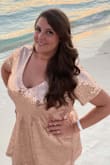 I was recently turning 40 and needed a birthday dress for Mexico STAT! They shipped this dress so quickly. I worried it would be a little snug because I'm shaped like a damn potato and tall like Sasquatch, so I ordered a 1XL. It fit me like a glove! It hid all my imperfections and not only looked fabulous, but made me feel fabulous! I received so many "ooh's" and "aah's"! I had so many compliments. The only issue I had after I received it was, some of the sequins had come off around the neckline during mailing and the dress was a little long for me (I love showing off my long legs). I had it tailored and he replaced the missing sequins with the leftover material, making it look perfect. He did recommend keeping it in a plastic bag and hung up to keep it in great condition. Thank you so much Lulus for making my birthday the BEST! - Courtney D.