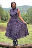 Ordered a small. Love the dress, the color, cut, and fit. This dress gives me retro vibes. Love the cut of the neck and all the frail details. The smocked waist allows for extra room. Really well-made dress. Adding this one to my favorites. Yes, I would recommend it. - Auxilia C.