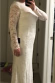 This dress is AMAZING! It is so comfortable because it's all stretchy material. It looks whiter than in the picture, which was good because I wanted a white dress, not ivory. I ordered an XL, but it was slightly too tight, more than the photos show. I'm not usually plus size, but I think it runs small due to the stretchy material, and also I wanted mine not to be skin tight for my religious ceremony. I have ordered a 1X and can't wait to try it on! Also, I would say that if you want the dress to look more off the shoulder, you can easily do that since it's stretchy, but if you want it to cover your shoulder more, that is also easy, depending on your body type. - Lindsay P.