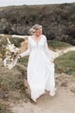 Loved this dress for the last minute wedding changes we had to make this year. We eloped at the coast and these long sleeve lace details made all my boho dreams come true! Wore a nude slip type thing under because the bottom portion is on the sheer side, but was able to make it work for sure!! Loved this look so so much, thank you Lulus! - Lainie A.