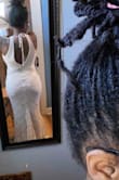 This dress is beautiful. Fits my body perfectly but is a little long. I plan on having it altered before my beach ceremony next summer. - Danielle G.
