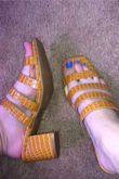I'm a 7 in heels, 7 1/2 in booties. I ordered a 7 and the top straps are a little loose but allows for easier walking without rubbing. I could have probably also got a 6 1/2 and would have been fine. They're adorable and work with any outfit! - Ashton A.
