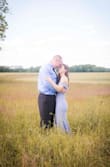 Funny story. I went to a bridal boutique almost a year before my wedding. I did the whole, "I said Yes!" thing. I bought an expensive wedding gown. (Did I mention non-refundable)? As time came closer to the wedding, I hated it. All I could think was how the dress I wore for my engagement photo's, (which was THIS dress in blue/gray), was so much prettier. So I did the unthinkable. I ordered this dress (again) but in white for $75 (w/ coupon code). And when I put it on, it was THE dress. You couldn't even tell that is was WAY less costly than my true wedding gown. It was stunning. I paired it with an extra long veil to add to the bridal look. No one even noticed that it was the same style dress I wore in my engagement photo's. If you're on a budget and getting married -- get this dress. Take it from a girl who bought an expensive gown and left it in the closet on her wedding day for THIS dress. (I included a picture of the blue/gray one I wore for my engagement photo's). - Jess R.