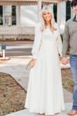 I bought this dress for engagement pictures and it photographs beautifully. I love the ivory color and how it's a true wrap dress. Also the buttons on the sleeves were beautiful. The only downside is that it gapes in the chest area, but this was nothing dress tape couldn't fix. - Maddie B.