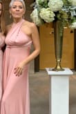 I ordered several dresses from lulu -I was a close friend of the bride so needed something vaguely bridal party-ish.
I am UK 57kg, and 30f bra size.
The dress is really easy to style = you can find something to suit your shape/look. With several bridesmaids it would mean built-in flexibility. There is a demo showing ways of how to style and you can come up with your own too.
I had thought about cutting the excess material once I had decided on a style as there was a lot/too much to play with. But cutting could have restricted use if I wanted to style it differently on another occasion.
The way I had this mean I couldn't wear a bra. I had stick-on cups but I find they are pretty useless, so tying under my bra-line / empire line helped but no vigorous jumping on the dance floor and there was some 'drop' of boob-pertness!!
Material is really nice and has stretch/give falls well but the nature of the sheen means it does show some of your excess bumps (most of us have 'em). You could always style it differently! - Nancy B.